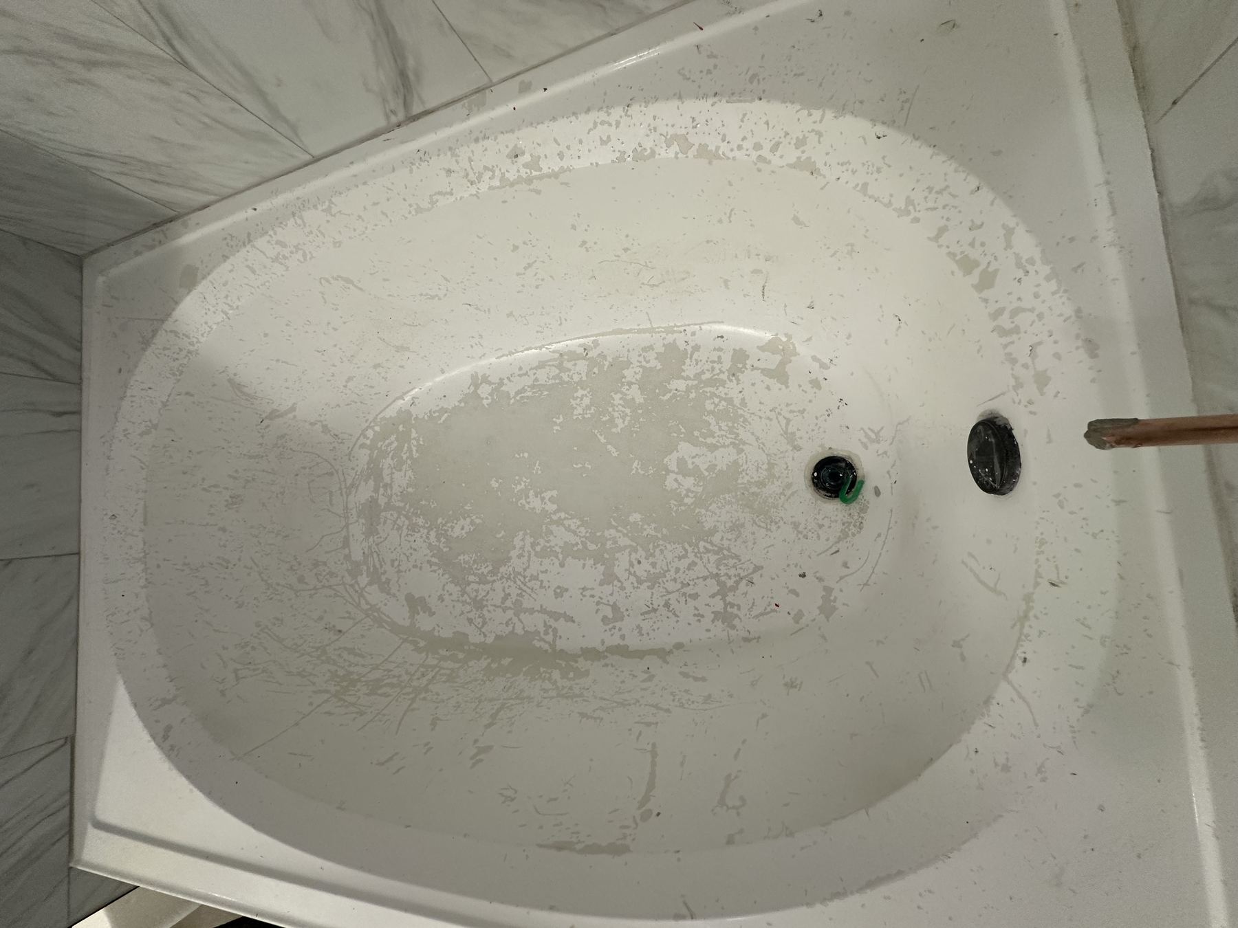 Fiberglass tub before refinishing in Austin.