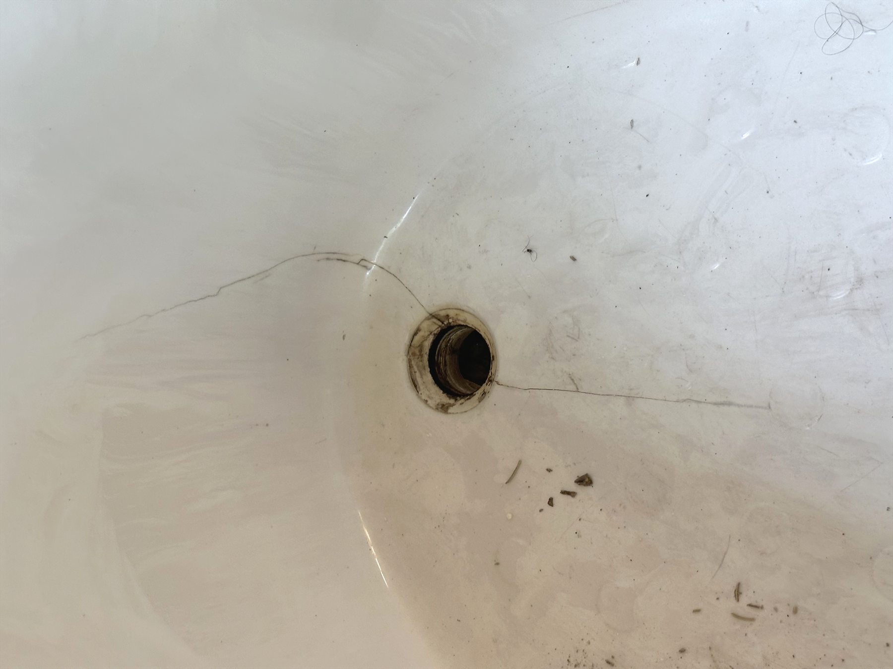 Cracked cultured marble tub near drain in Austin TX