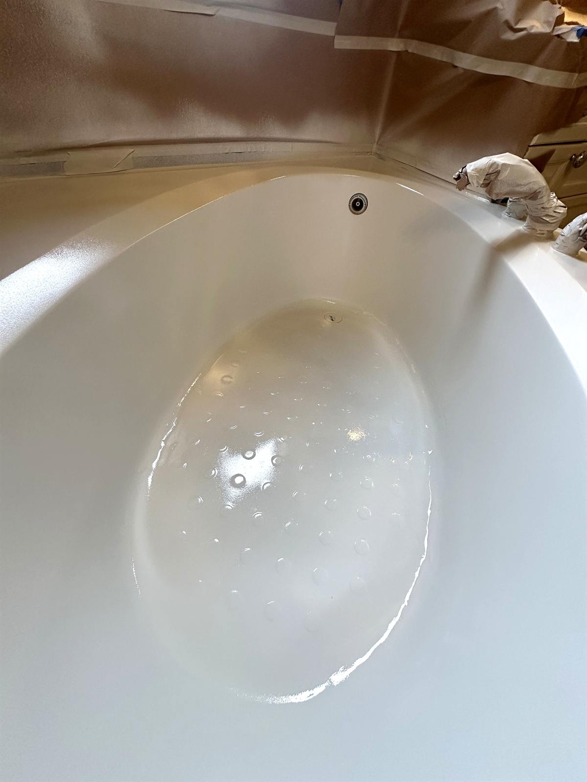 After refinishing and repair with clean tub-and-tile surround